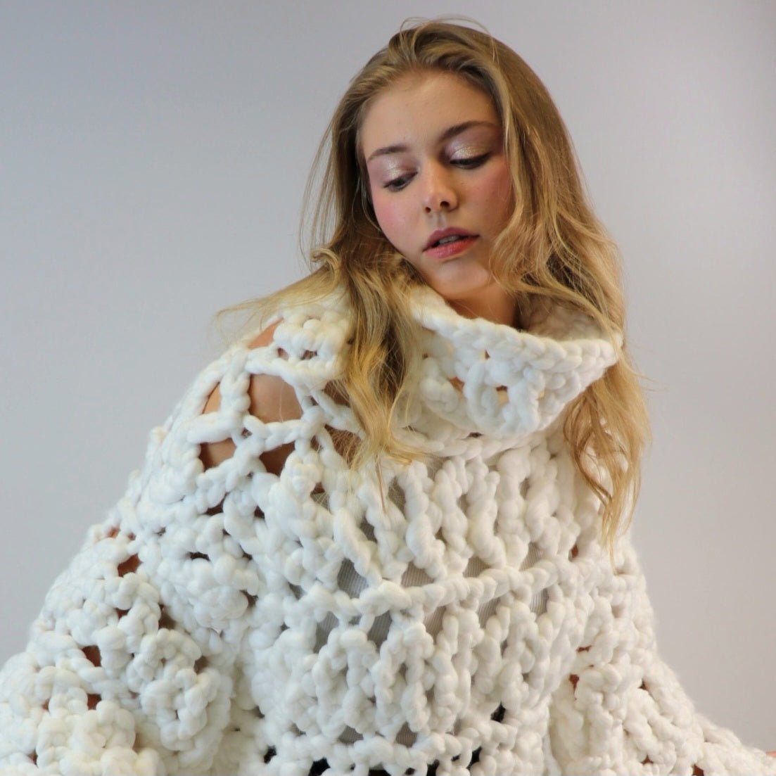 Shone statement knitwear. White oversized, chunky colossal knit sweater, turtle neck design knitted with super soft vegan and sustainable yarn. 